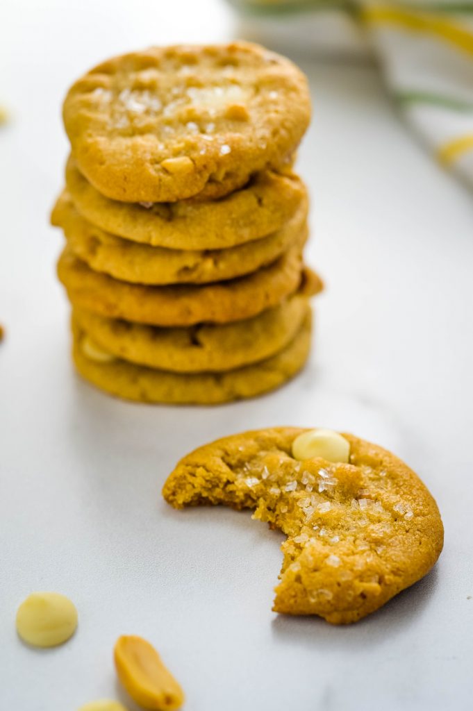 a stack of white chocolate peanut butter cookies.