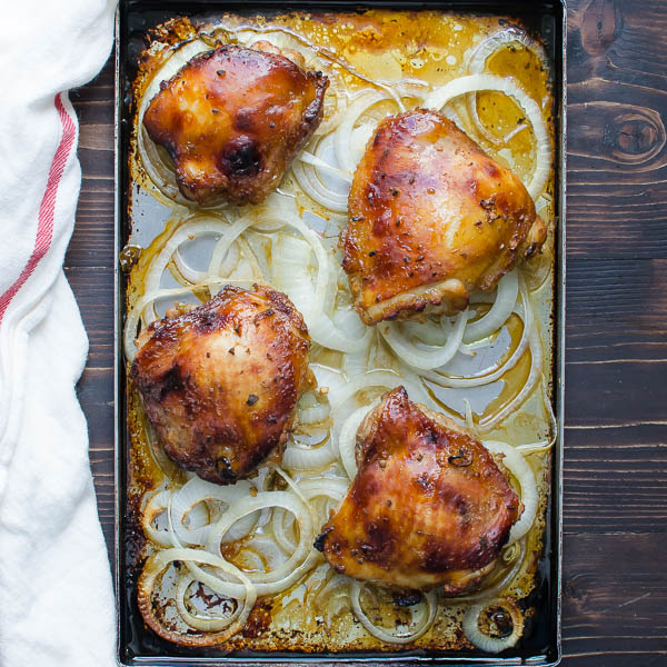 Juicy Asian-Style Chicken Thighs on a baking sheet.