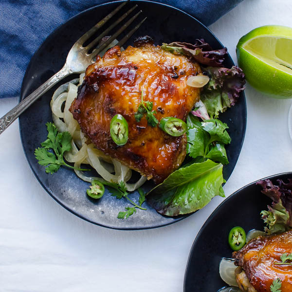 Juicy Asian-Style Chicken Thighs with a fork.
