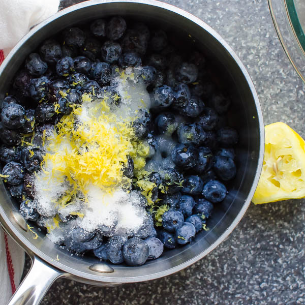 Making blueberry compote.