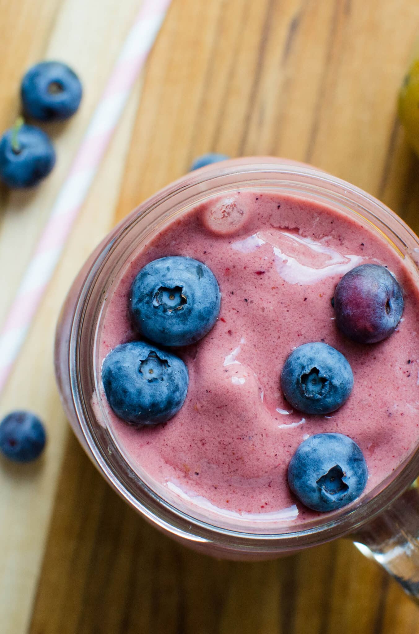 A mango smoothie with blueberries.