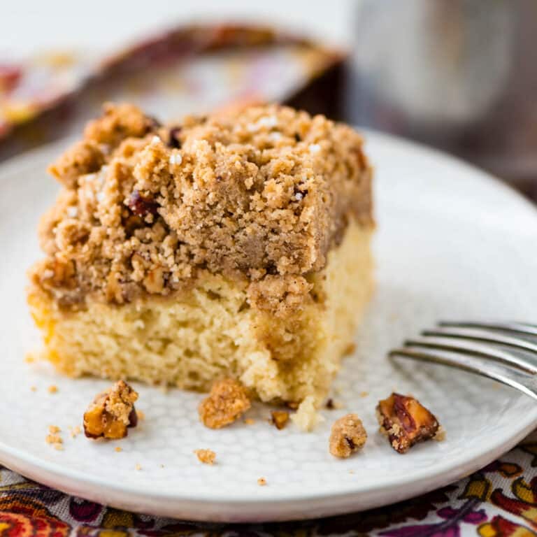 A slice of New York crumb cake on a plate.