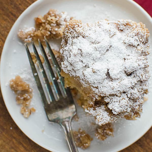 a slice of coffee cake with powdered sugar.