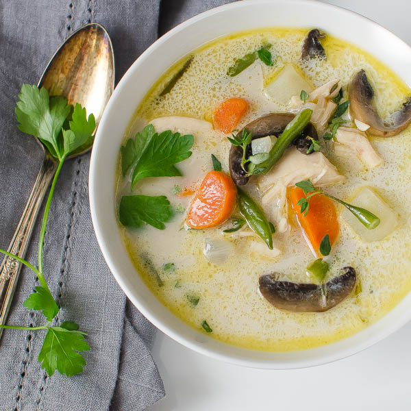 Creamy Turkey Vegetable Soup with spoon and garnish