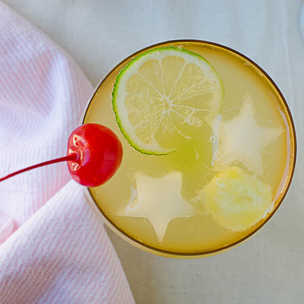 Pineapple Green Tea Punch with cherry and lime