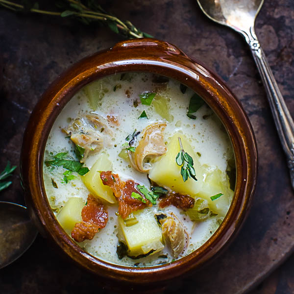 Authentic New England Clam Chowder garnished with bacon and thyme