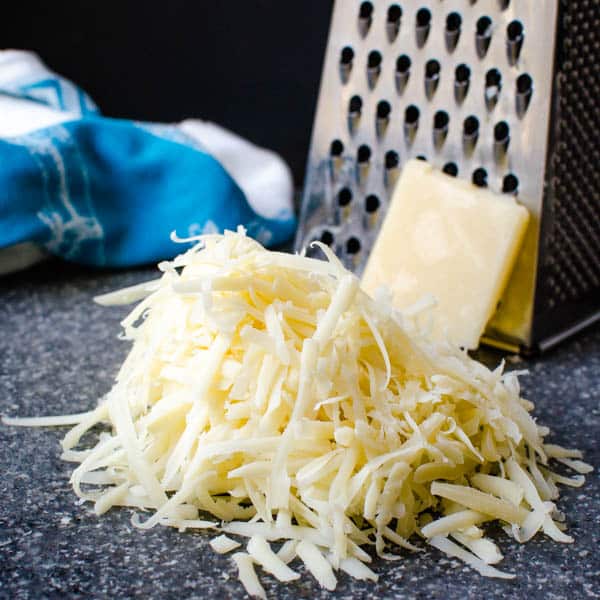 shredded cheese and a cheese grater.