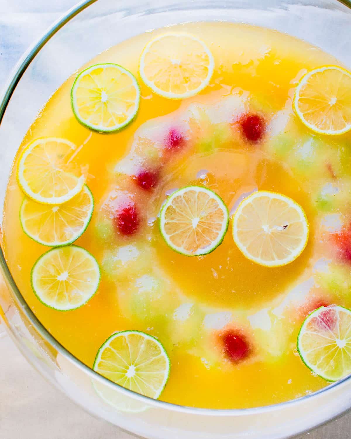 A punch bowl filled with the pineapple green tea punch.