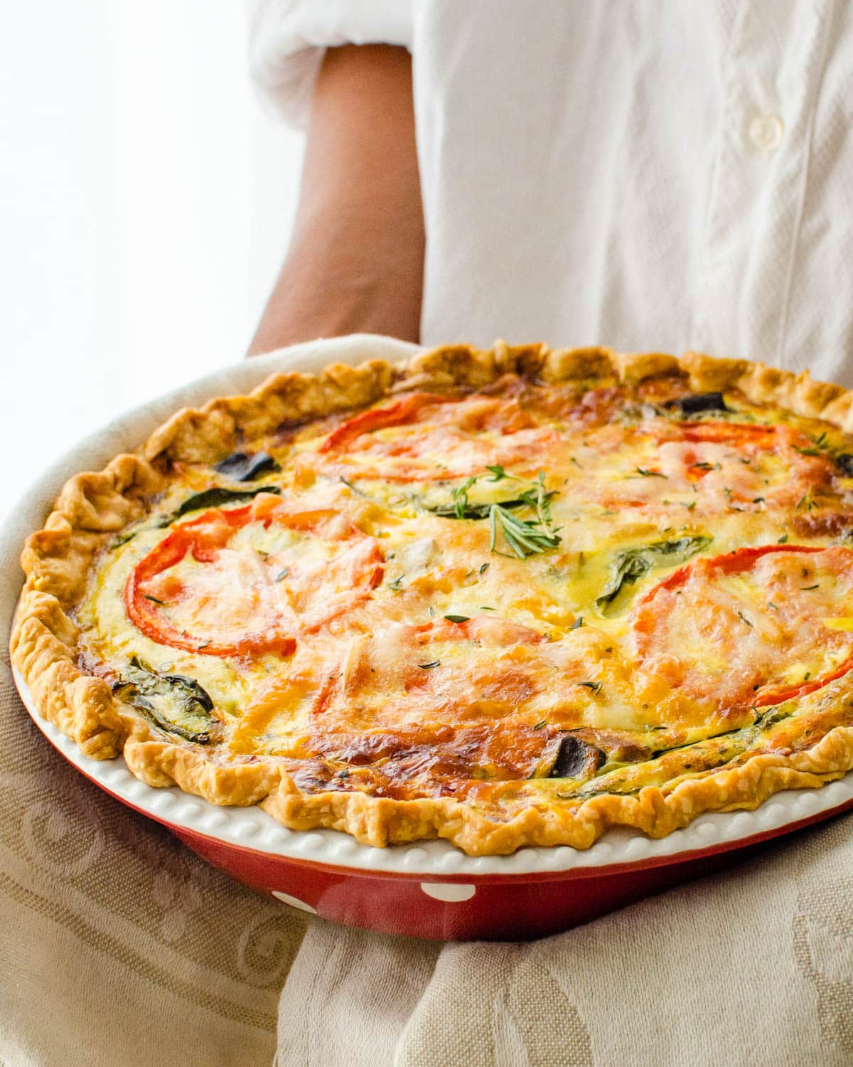 Taking the ratatouille quiche from the oven.