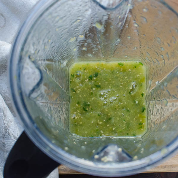 Blending cilantro with Authentic Spicy Salsa Verde