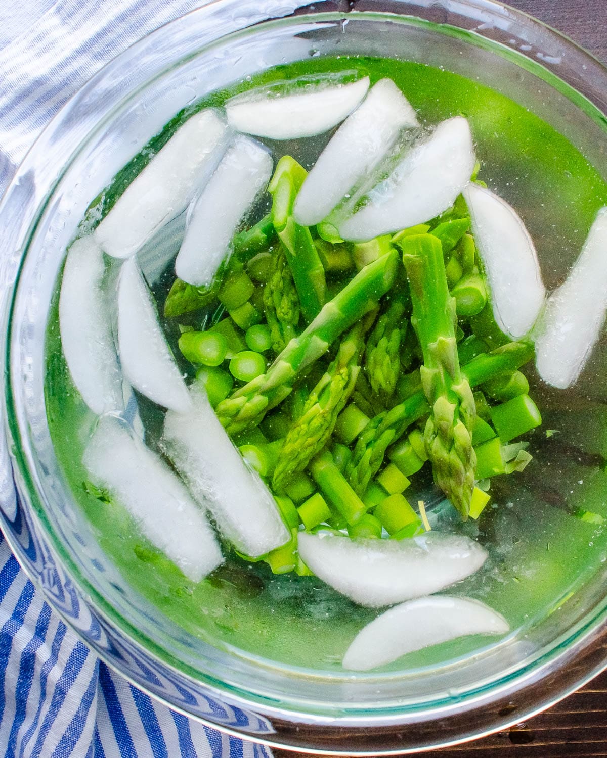 shocking the asparagus in an ice bath.