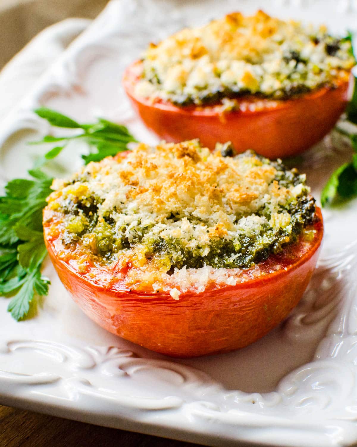 Roasted tomatoes with pesto and breadcrumbs.