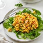 Curried chicken salad on a bed of arugula for a light lunch.
