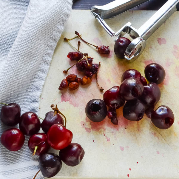 cherries and a cherry pitter.