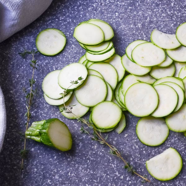 Thinly sliced zucchini rounds.