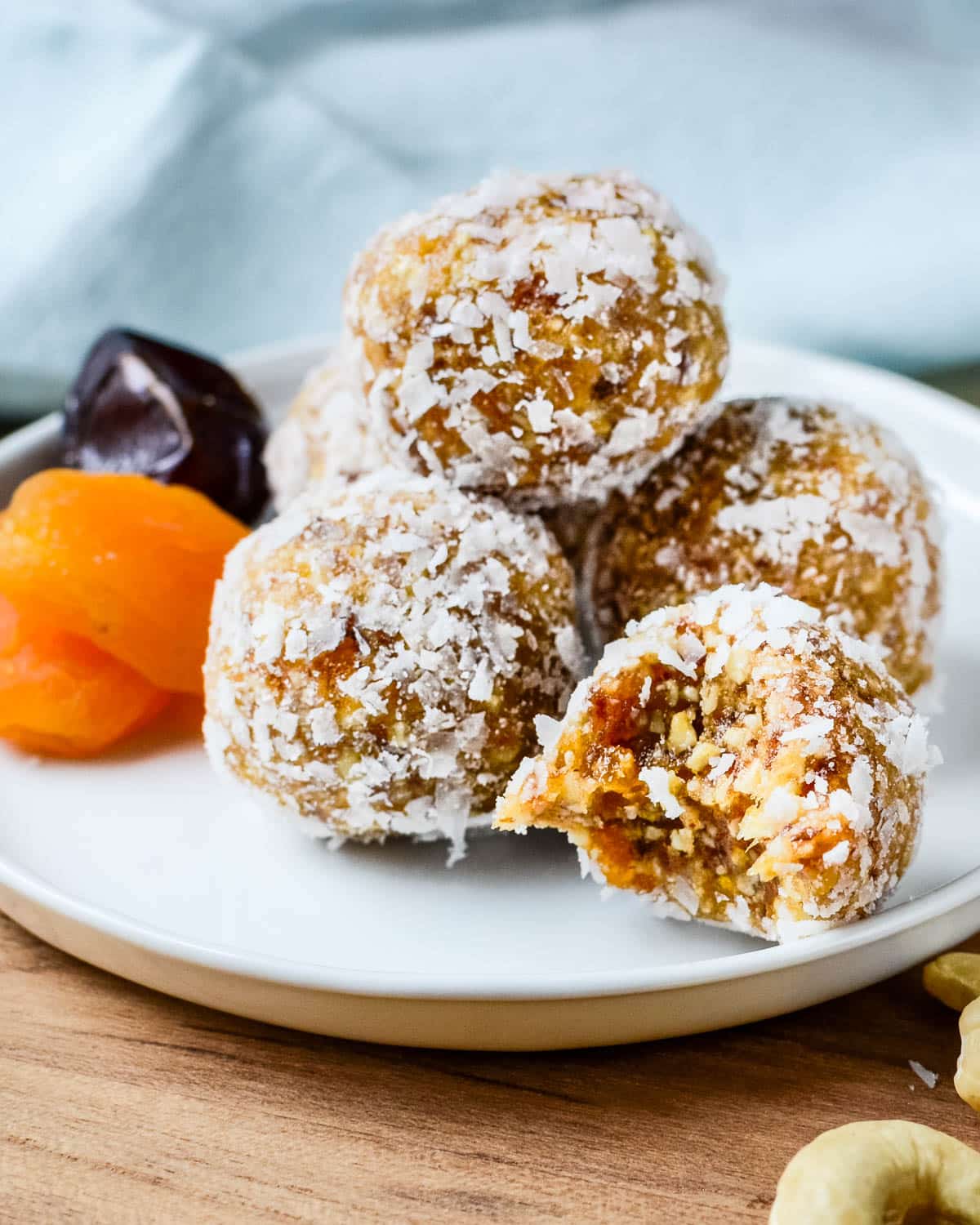 apricot date bites on a plate.