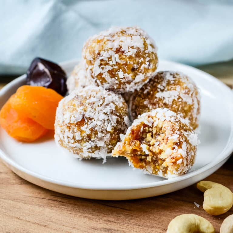 apricot bliss balls on a plate.