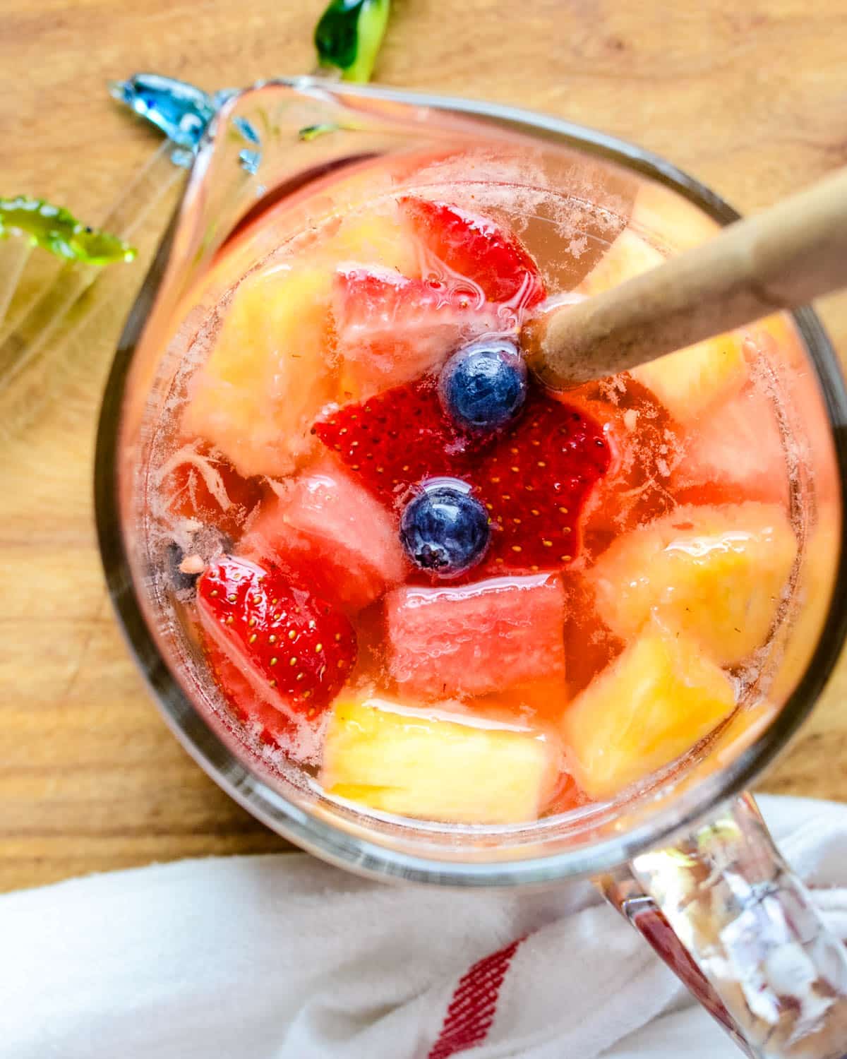 Summer fruit sangria in a pitcher.