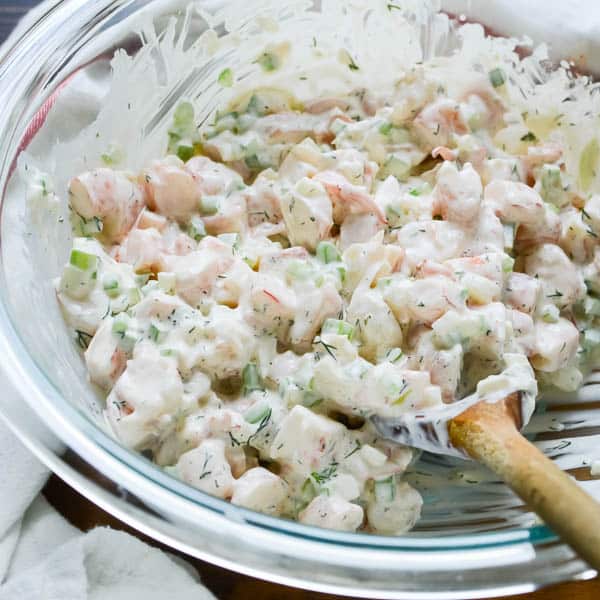 Easy Poached Shrimp Salad being mixed.