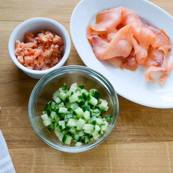 salmon and diced cucumber in a bowl.