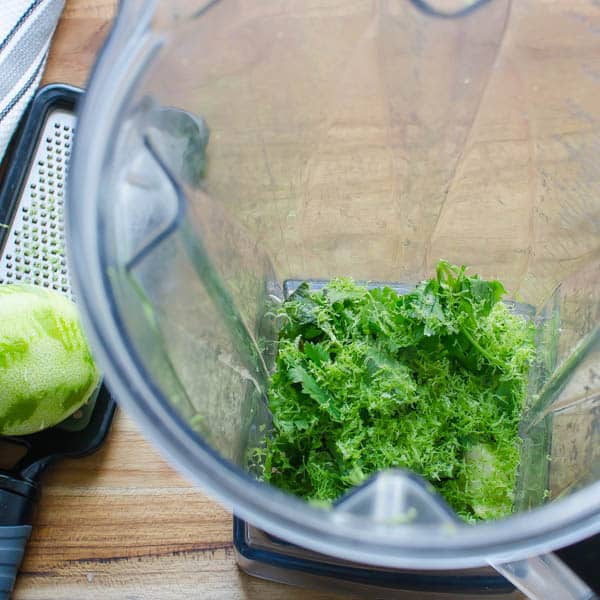 cilantro and lime zest in a blender.