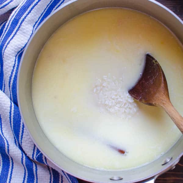 rice and milk in a pot with spoon