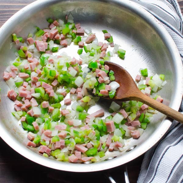 ham and diced vegetables in a pan.
