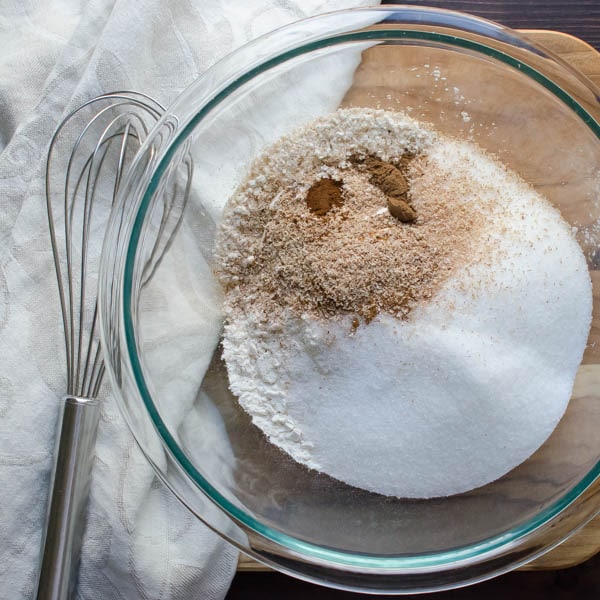 mix dry ingredients with a whisk for snack cake recipe.
