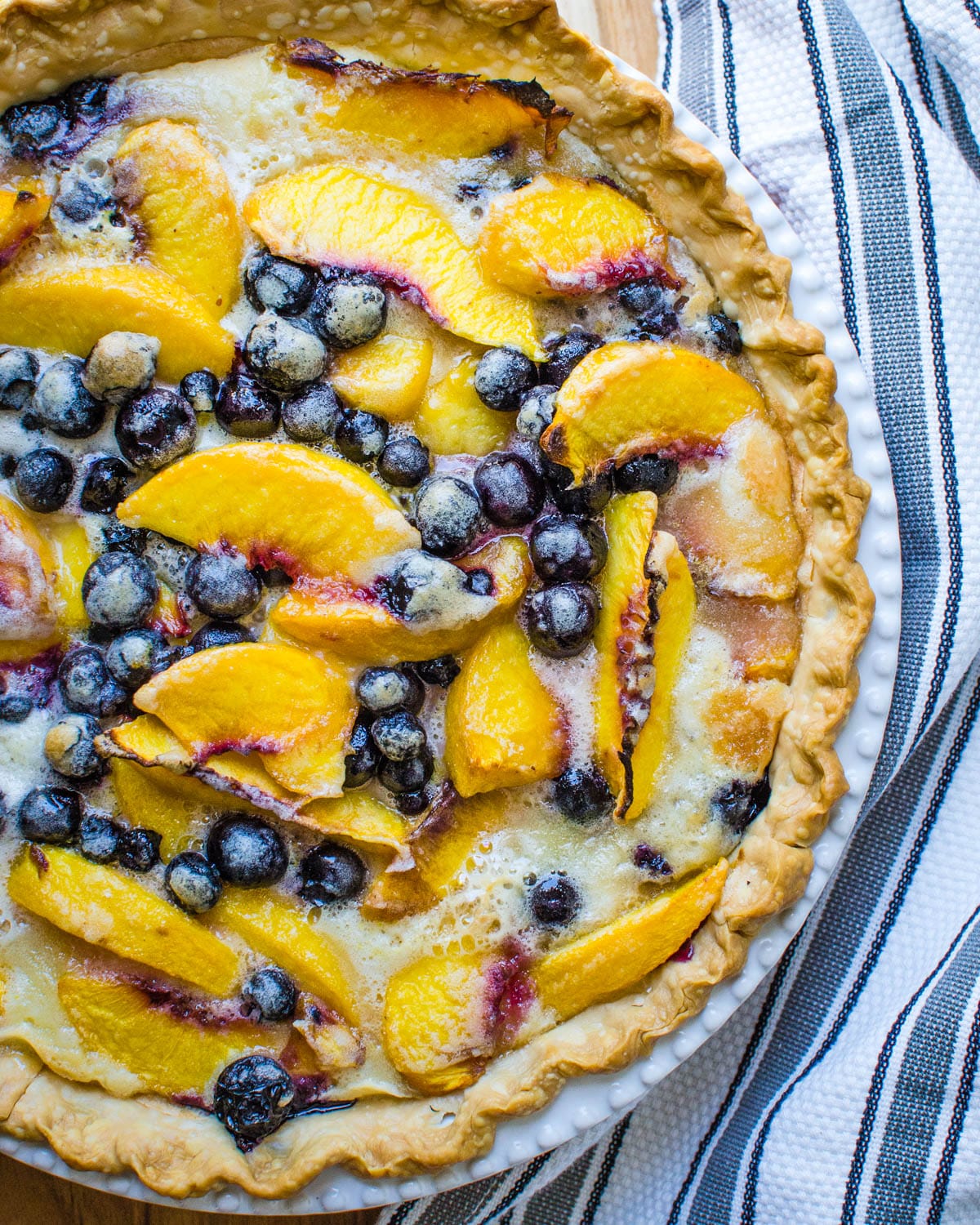 A peach and blueberry pie.