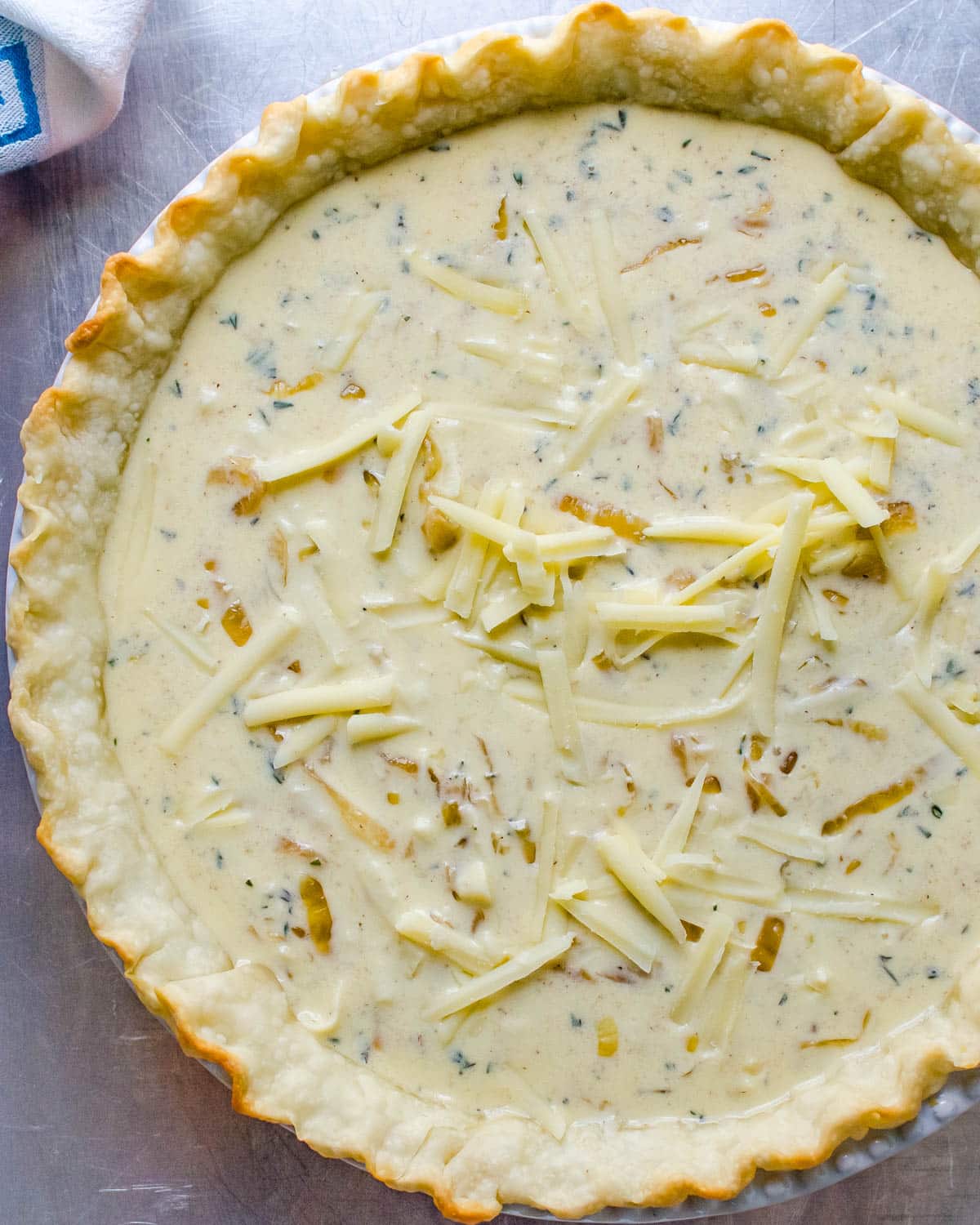 I am transferring the quiche custard to the blind-baked shell.