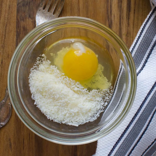 grated parmesan cheese and an egg.