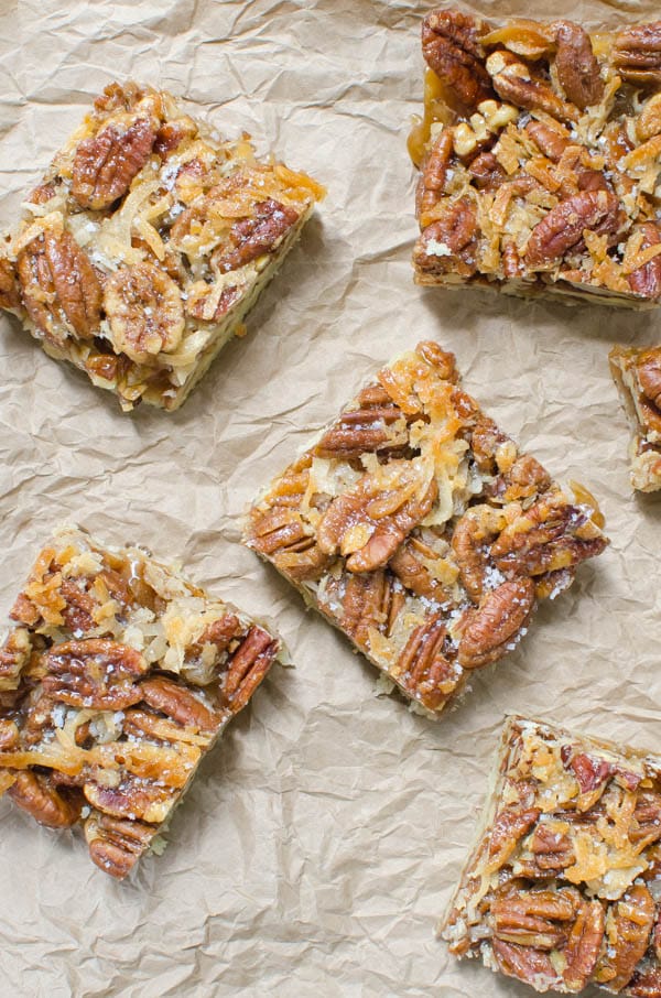 Salted Coconut Pecan Bars on brown paper