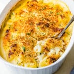 Serving the cauliflower au gratin with a spoon.