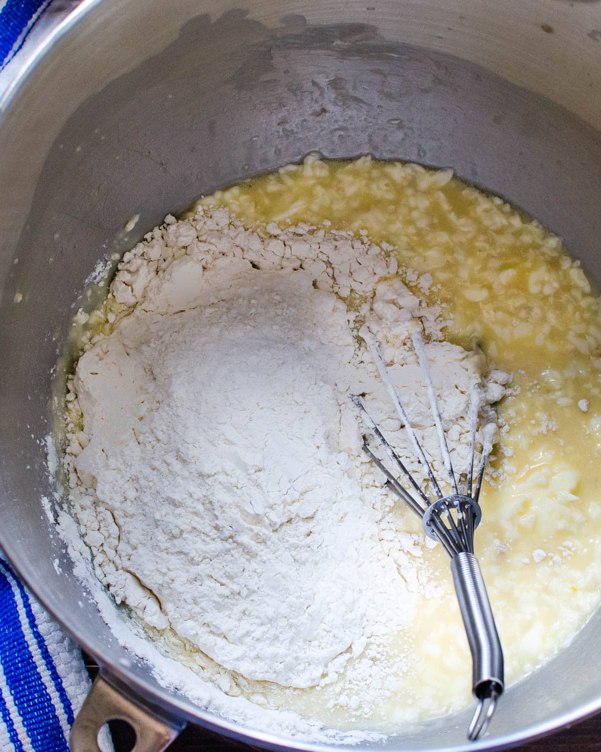 Adding flour to the sponge.