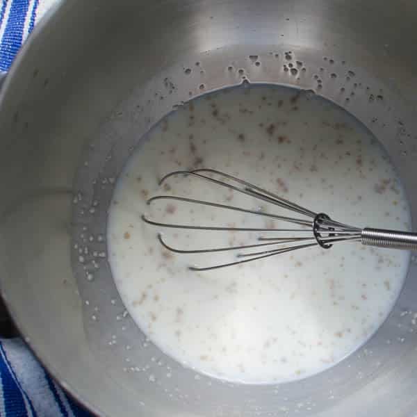 yeast and milk with whisk