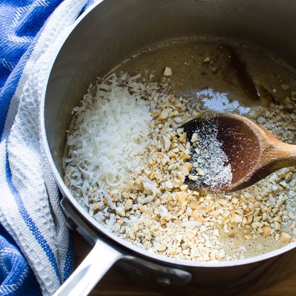 adding cashews and coconut to batter.