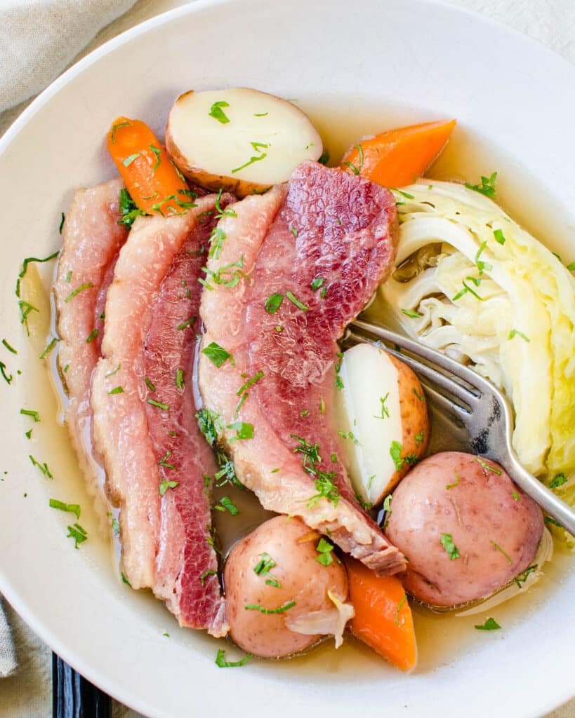 A bowl of corned beef and cabbage.