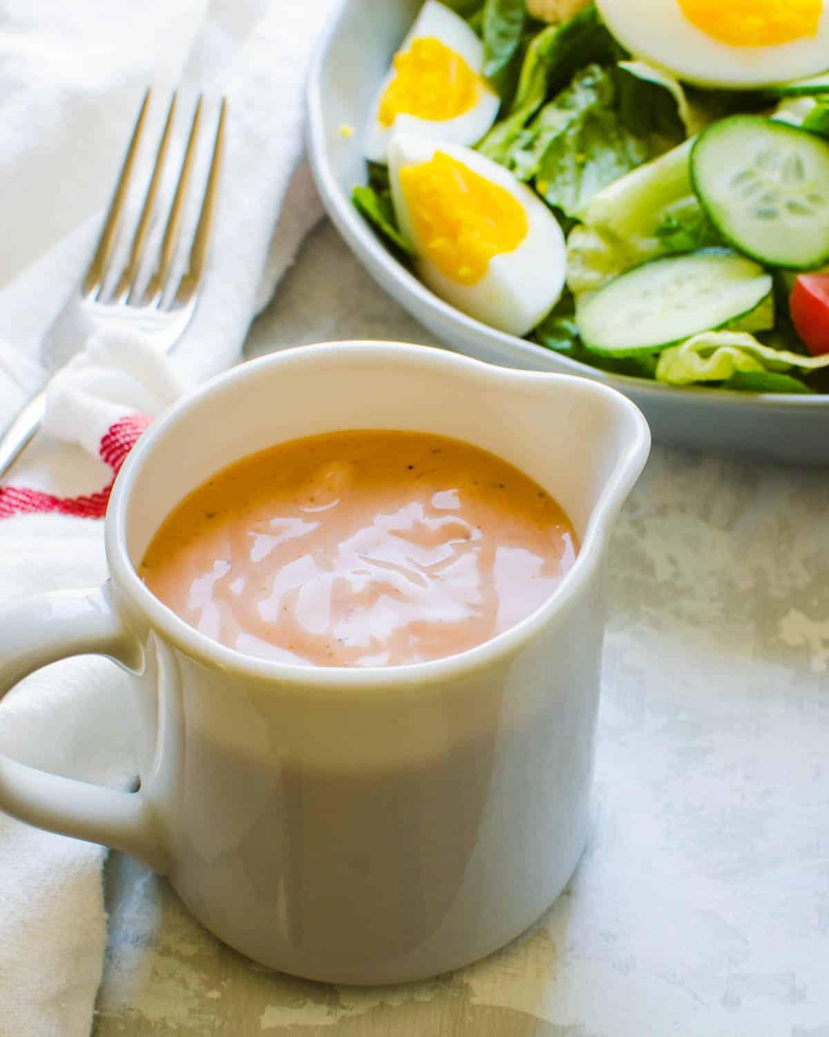 A pitcher of Russian dressing.