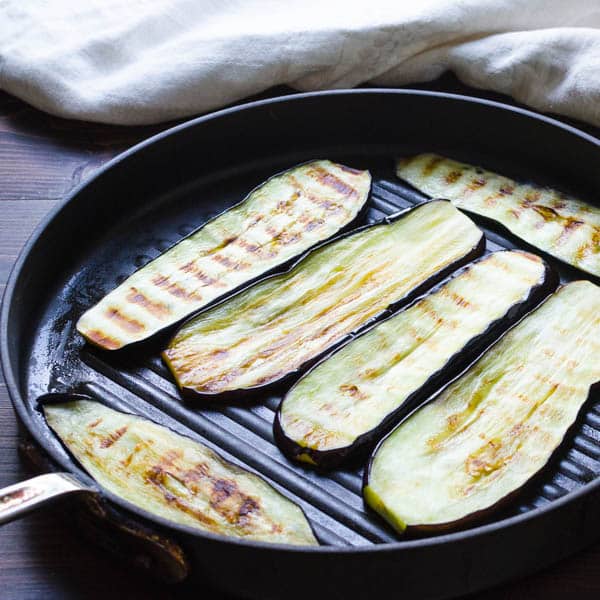 grilling eggplants in a grill pan