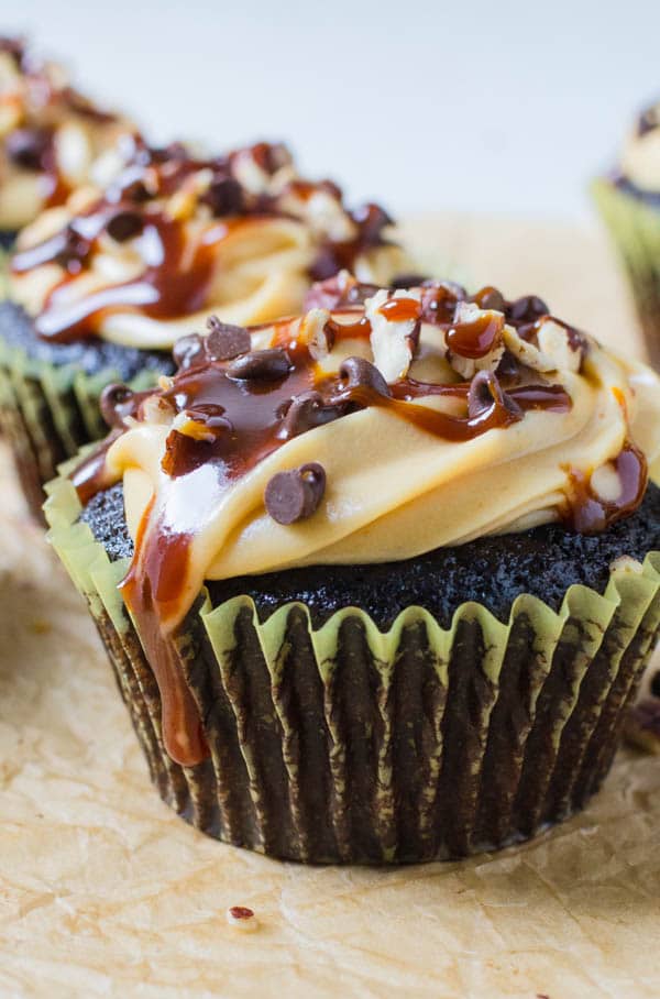  Small Batch Turtle Cupcakes decorated with pecans and chocolate chips.