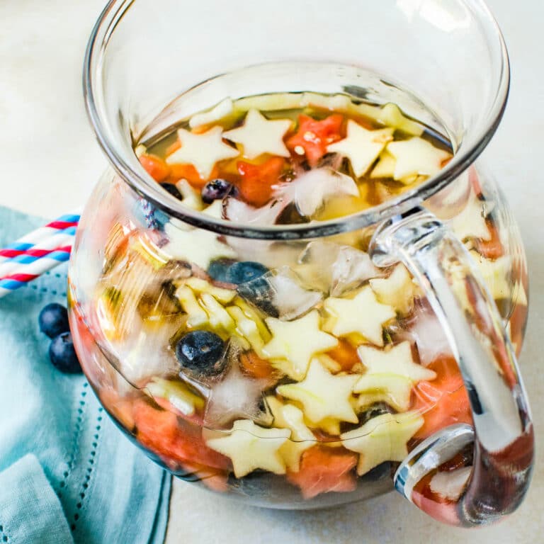 a pitcher of red white and blue sangria