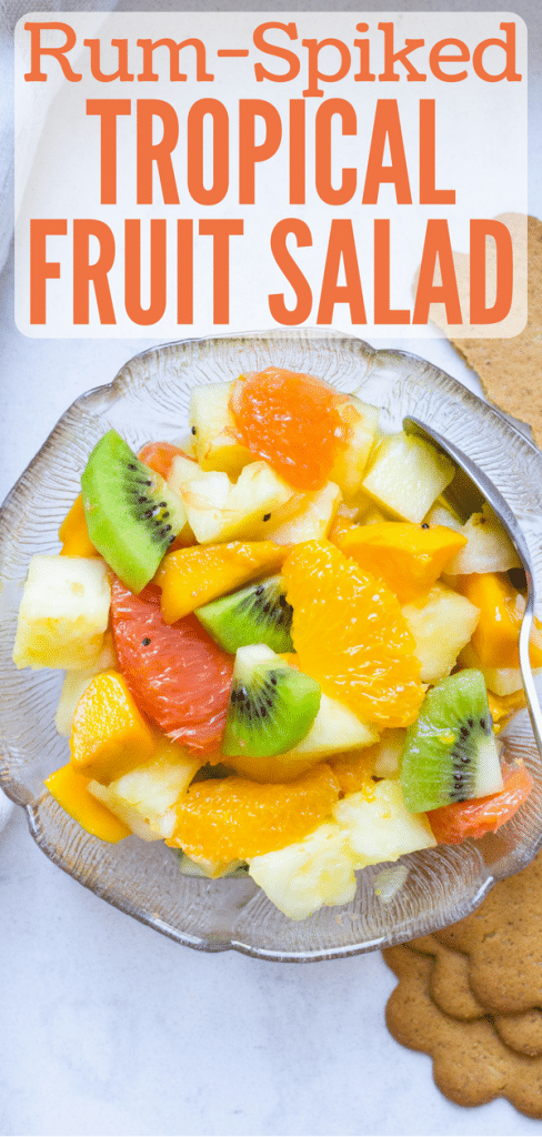 If you live in the tropics, you know the abundance of yield that comes from tropical fruit trees and why you need a tropical fruit salad recipe in your back pocket for when the fruit is ready. This healthy fruit salad gets a hearty dose of dark rum for a rum-spiked tropical fruit salad you'll love. #fruitsalad #tropicalfruit #pineapple #oranges #kiwi #mango #rum #darkrum #healthyfruitsalad #fruitsaladwithrum #papaya #guava #citrus #dragonfruit #starfruit