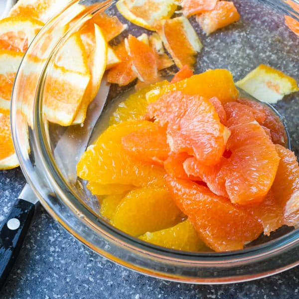 segmented oranges in a bowl.