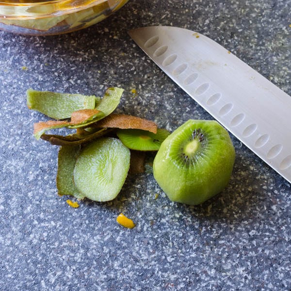 peeling a kiwi.