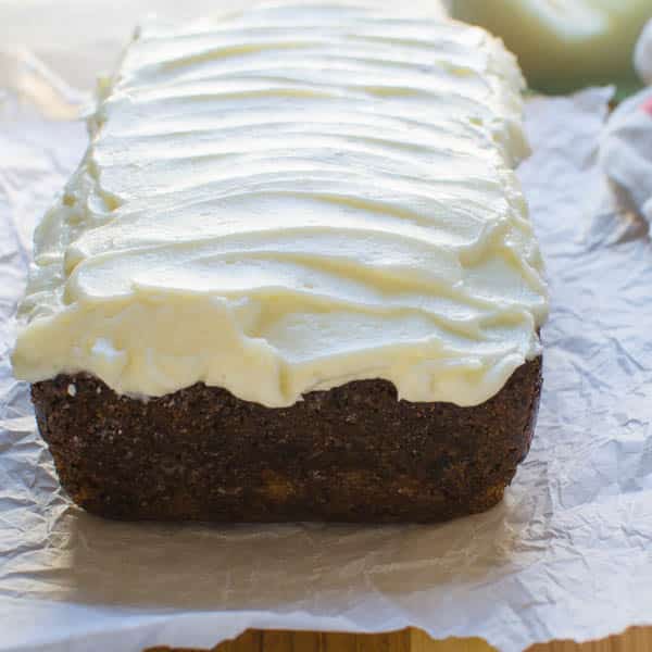 Ultra Moist Zucchini Bread with cream cheese frosting on top.