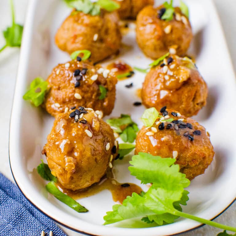 A tray filled with Asian meatballs.