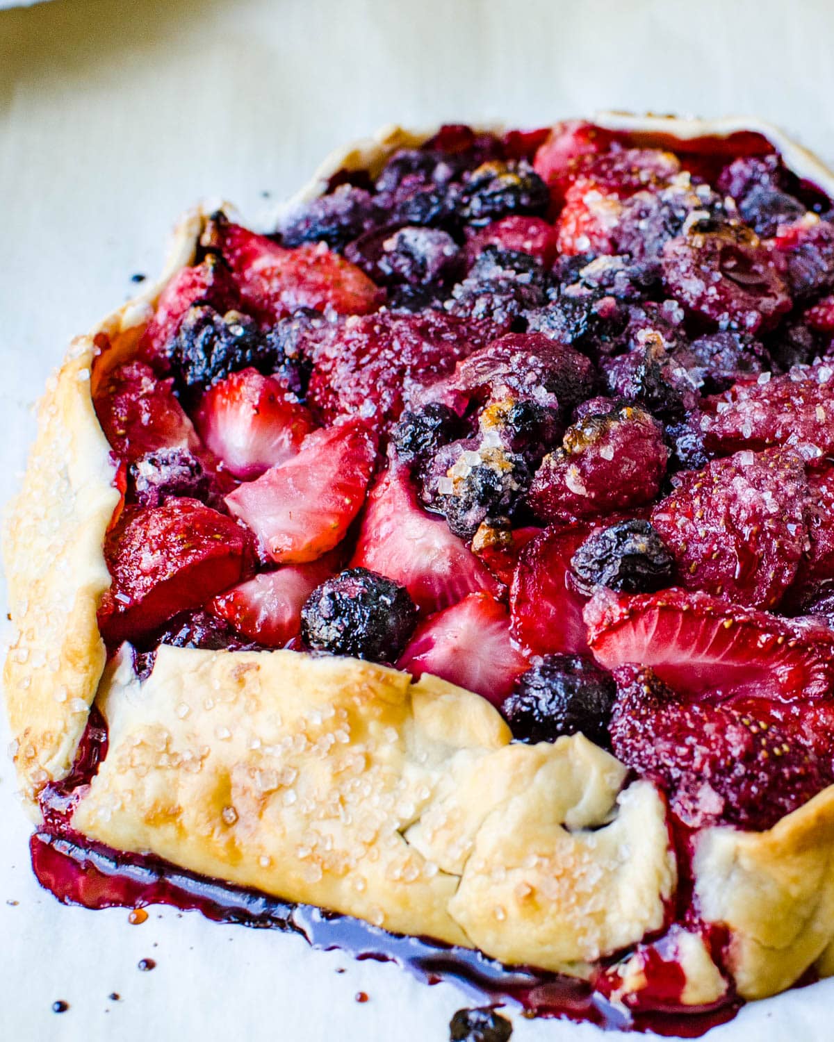 A mixed berry free form tart baked until golden.