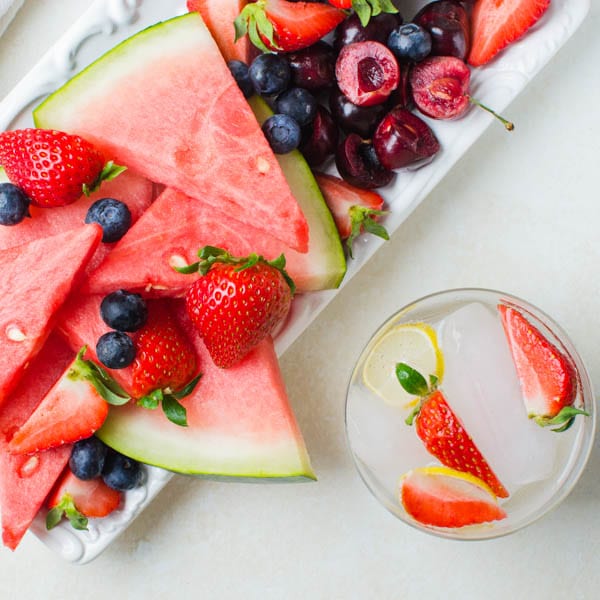 fresh fruit platter with sparkling water.