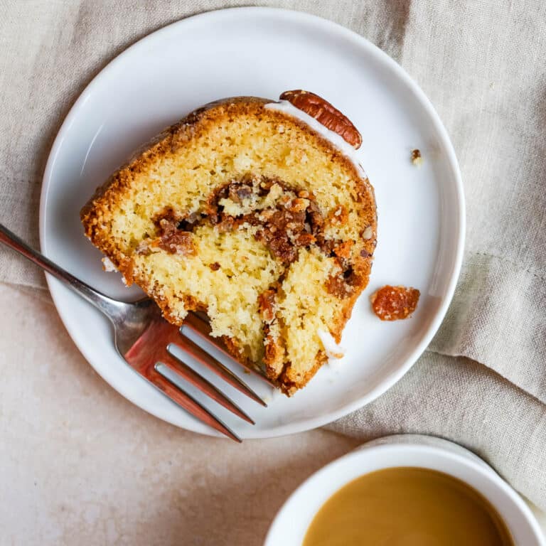 A slice of apricot nut coffee cake on a plate.