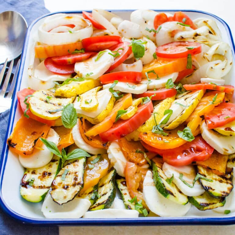 a platter of grilled caprese with squash.